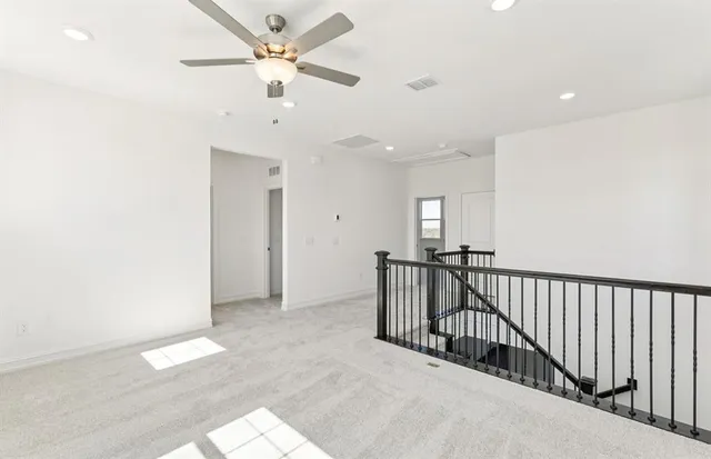 wooden floor in a hall with a window