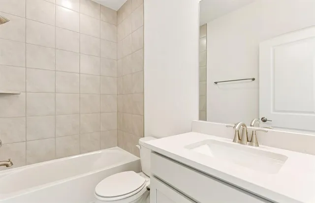 a bathroom with a sink a toilet and a bathtub