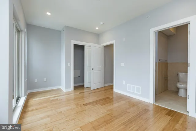 a view of livingroom with walk in closet and bedroom