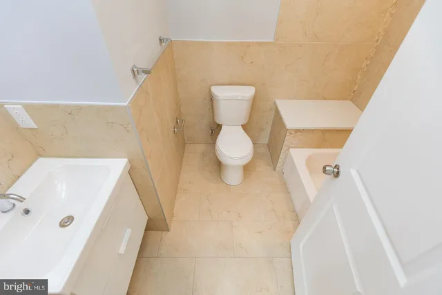 a bathroom with a sink and toilet