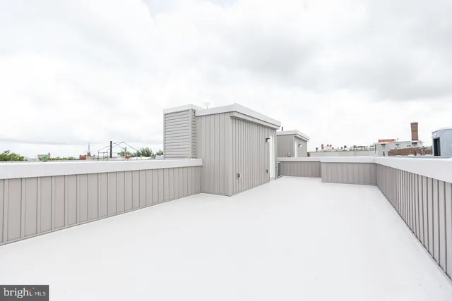 a terrace view with two chairs and a big yard