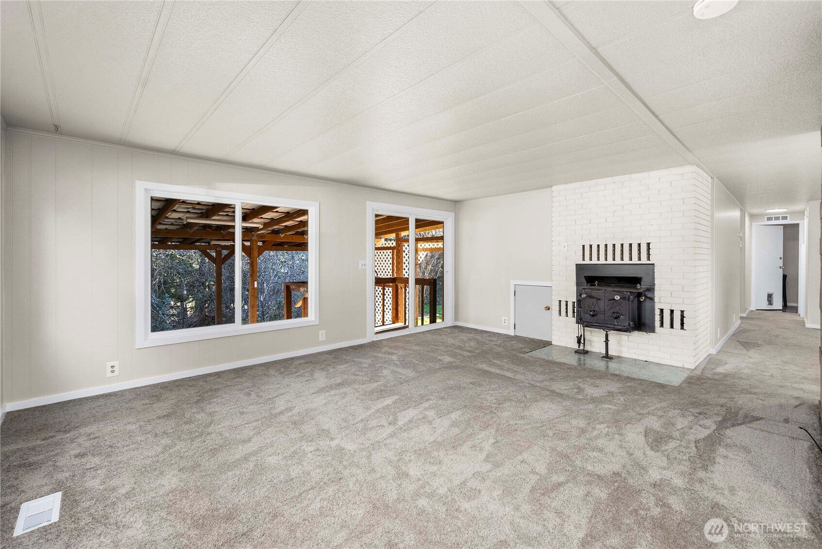 733 Tipsoo Loop South Rainier, WA 98576 - Photo 17 of 37 a view of an empty room with a fireplace and a window