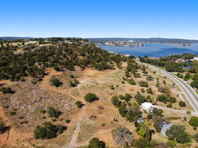 a view of a large body of water with a building in the background