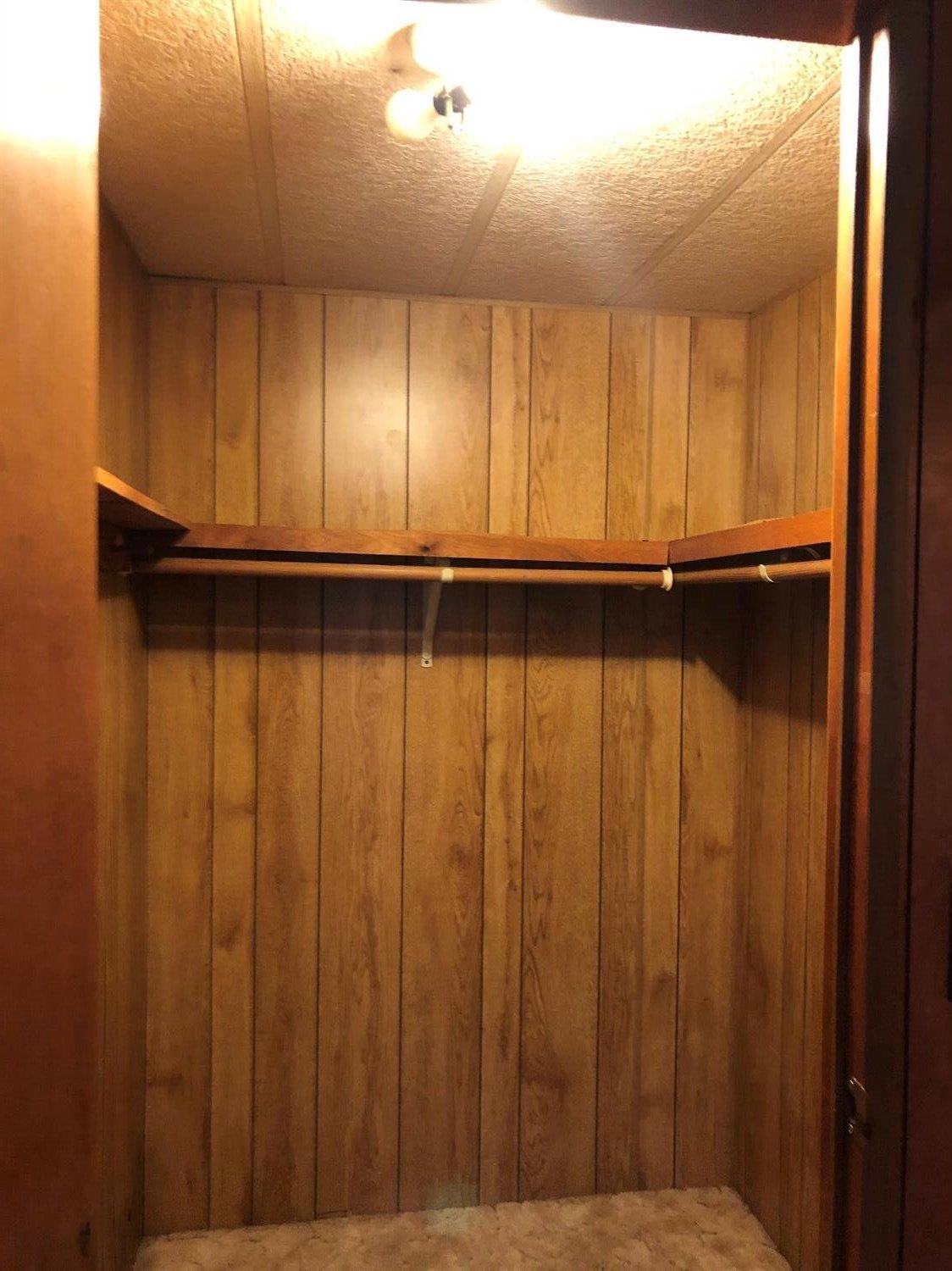 6226 East Evans Creek Road, Unit 15 Rogue River, OR 97537 - Photo 21 of 30 a view of an empty room with wooden floor