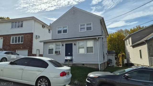 a front view of a house with parking space
