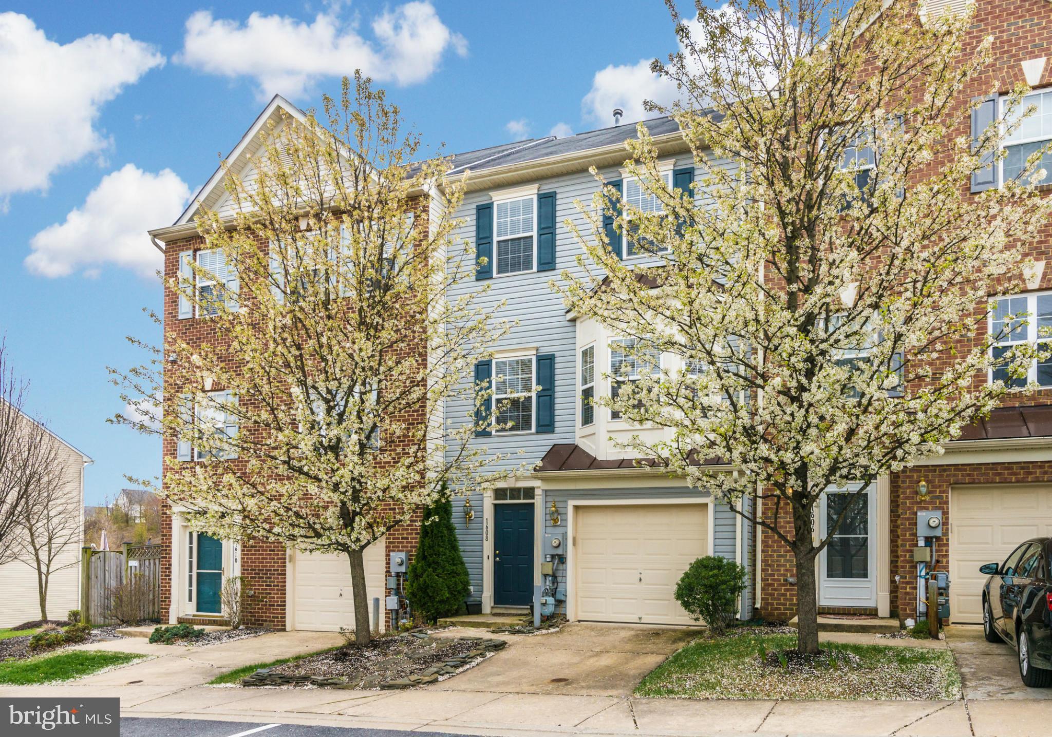 1608 Trestle Street Mount Airy, MD 21771 - Photo 2 of 24 a view of a white building among the street with palm trees