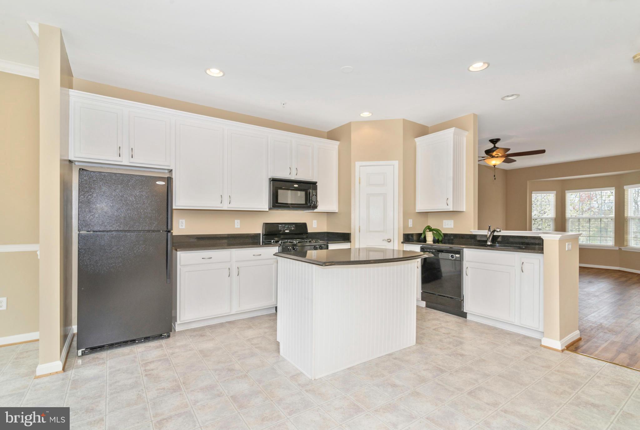 1608 Trestle Street Mount Airy, MD 21771 - Photo 12 of 24 a kitchen with a refrigerator stove top oven and sink
