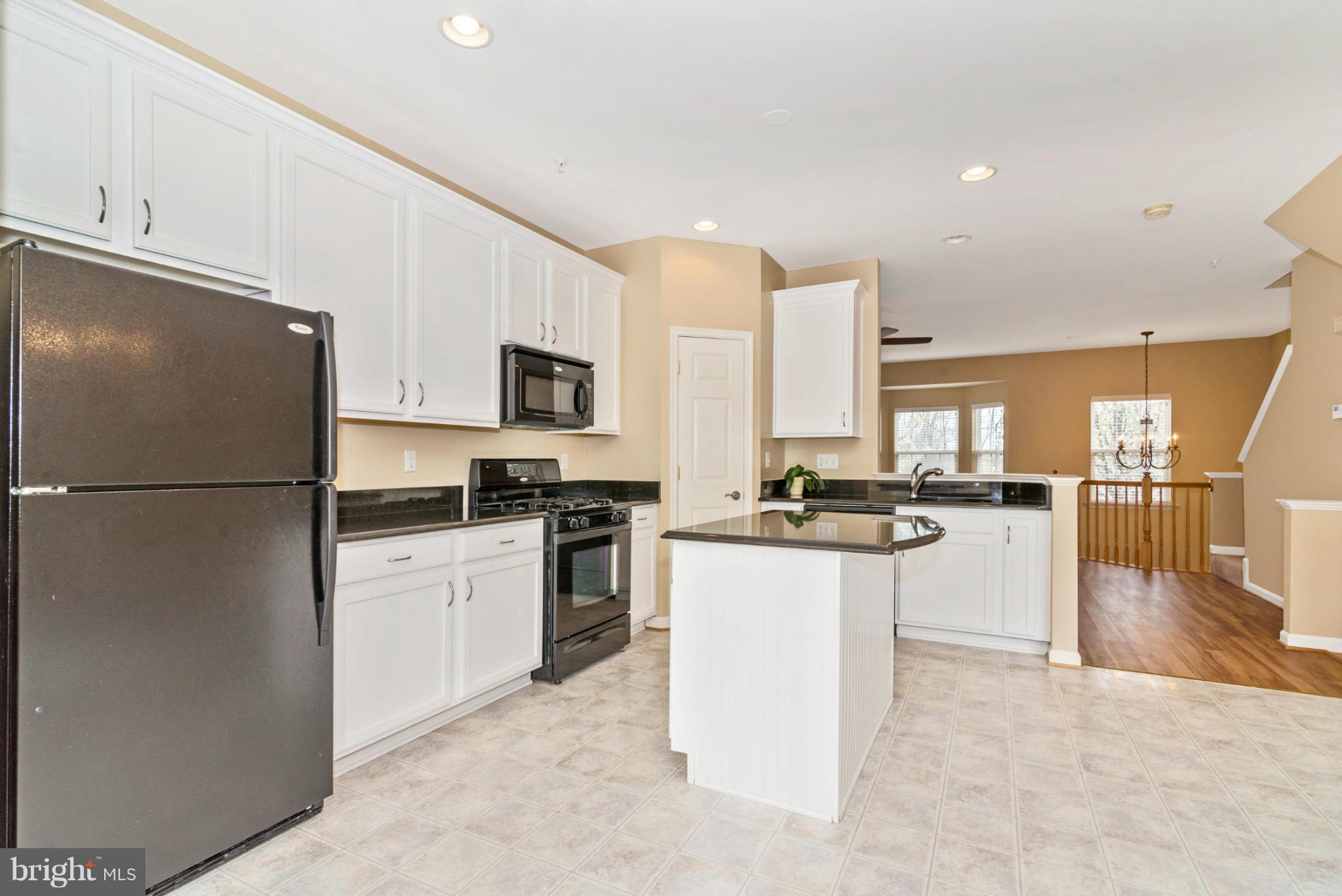 1608 Trestle Street Mount Airy, MD 21771 - Photo 14 of 24 a kitchen with refrigerator and cabinets