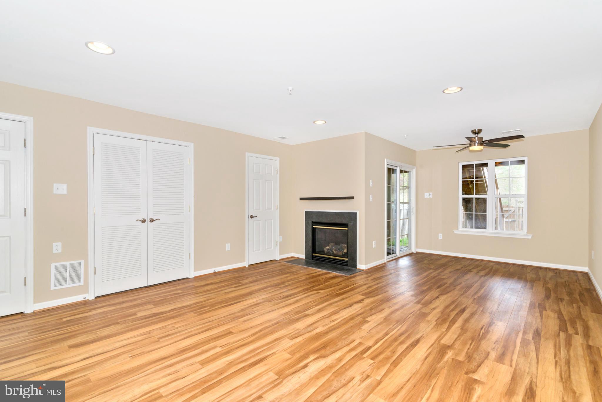 1608 Trestle Street Mount Airy, MD 21771 - Photo 21 of 24 a view of empty room with wooden floor and fireplace