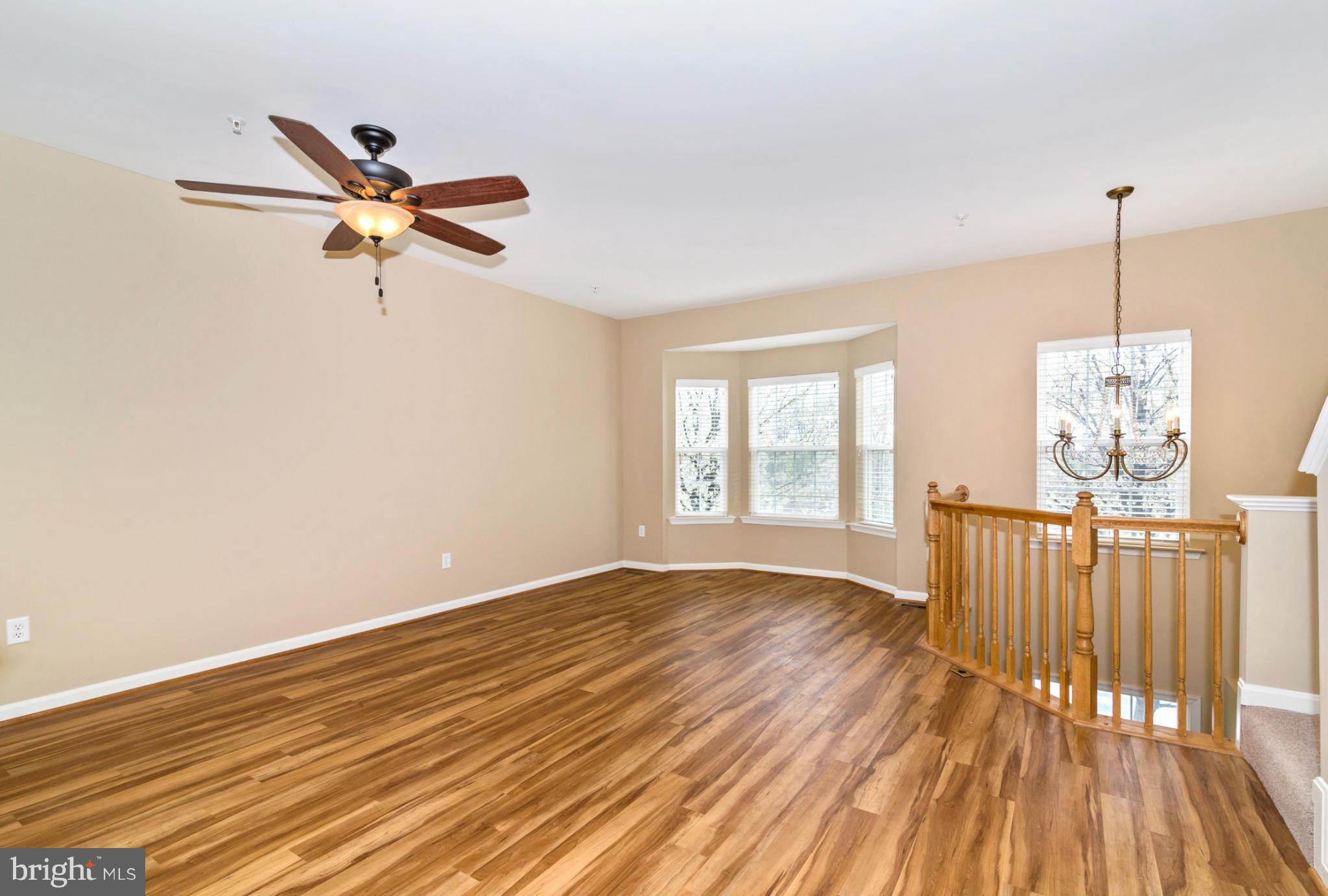 1608 Trestle Street Mount Airy, MD 21771 - Photo 5 of 24 a view of a room with wooden floor and a window