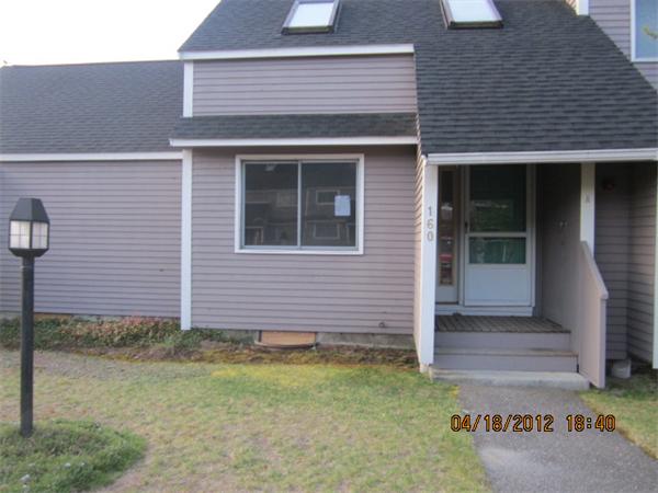 160 Ayer Road, Unit A Shirley, MA 01464 - Photo 1 of 7 a front view of a house with garden
