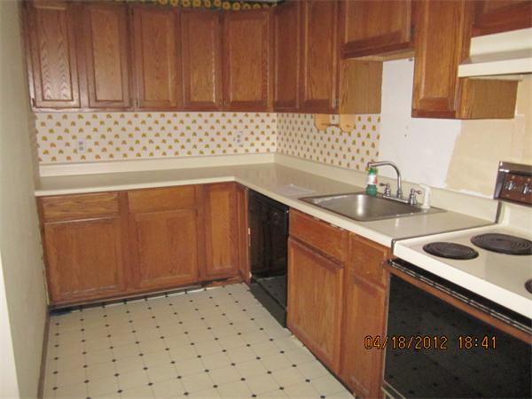 160 Ayer Road, Unit A Shirley, MA 01464 - Photo 4 of 7 a kitchen with a sink a stove and cabinets