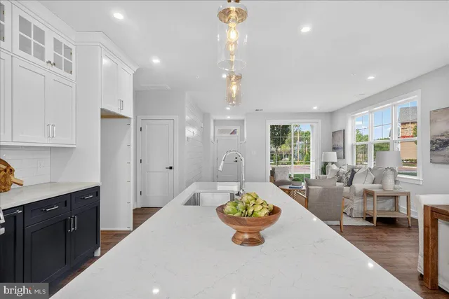 a large kitchen with a table and chairs