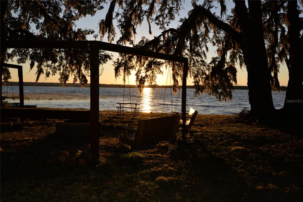 25144 Northeast 140th Loop Fort McCoy, FL 32134 - Photo 1 of 17 a lake view with outdoor seating