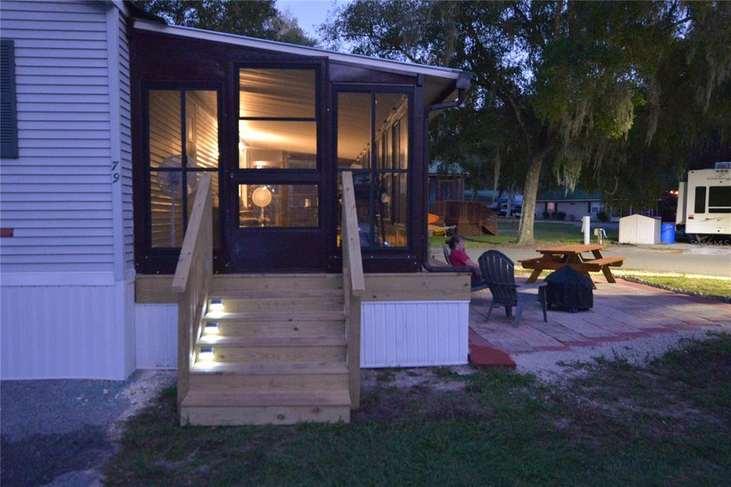 25144 Northeast 140th Loop Fort McCoy, FL 32134 - Photo 16 of 17 a front view of a house with a yard