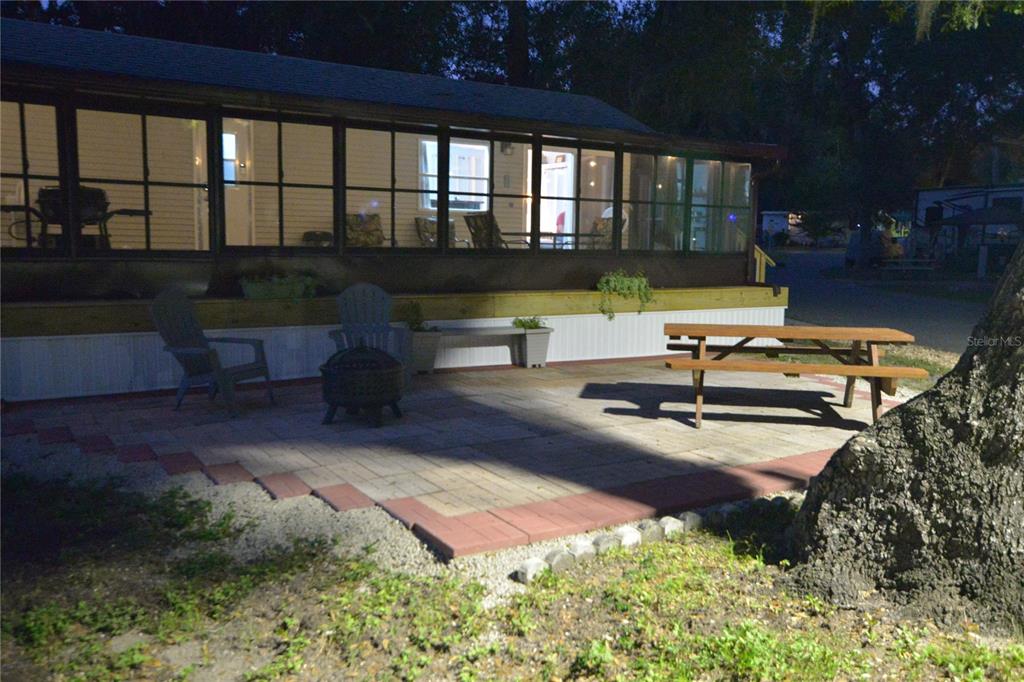 25144 Northeast 140th Loop Fort McCoy, FL 32134 - Photo 17 of 17 a view of a swimming pool with an outdoor seating and a yard
