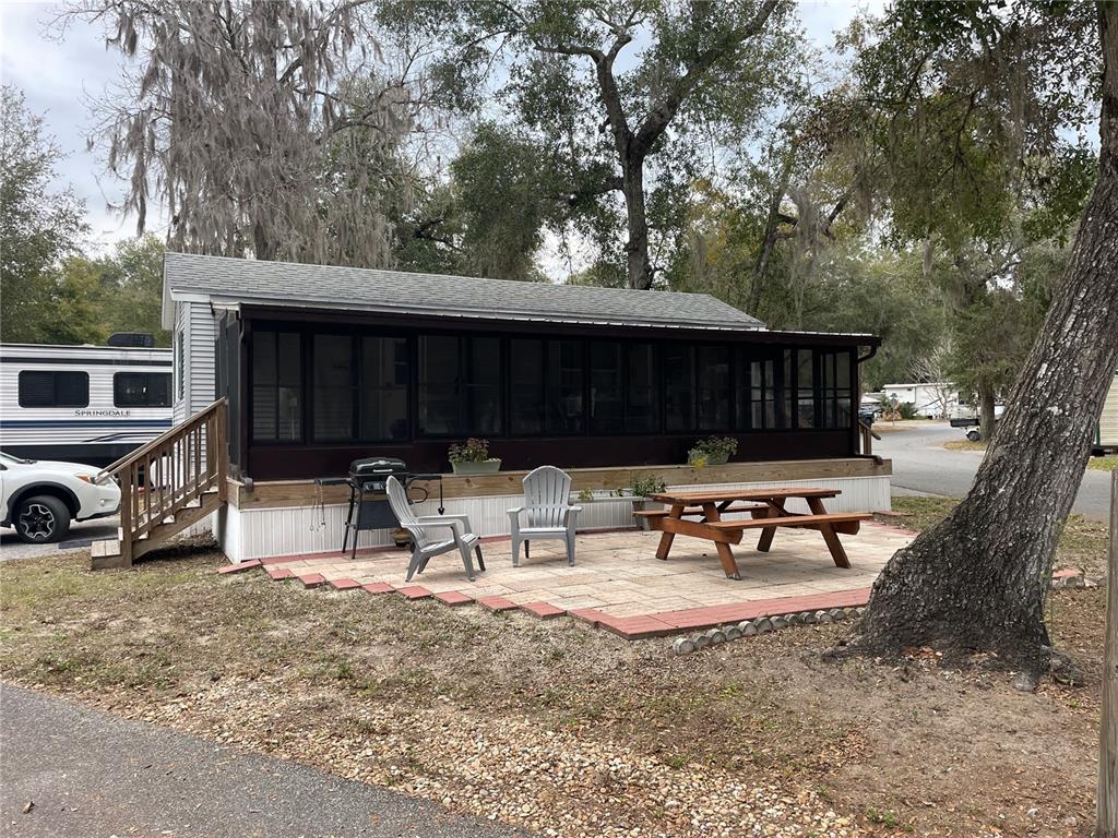 25144 Northeast 140th Loop Fort McCoy, FL 32134 - Photo 2 of 17 a view of a backyard with a sitting area