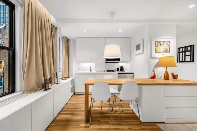 a picture of a park with a large white wall