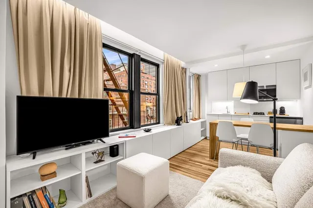 a kitchen with stainless steel appliances a stove refrigerator sink and cabinets