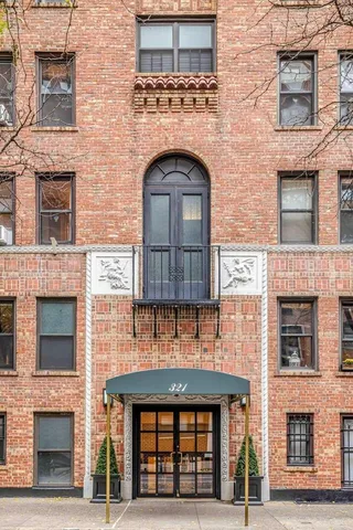a swimming pool with outdoor seating and yard