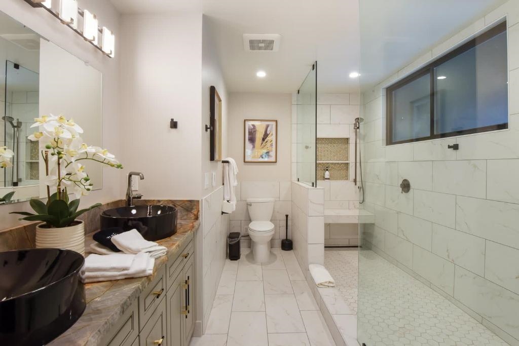 1163 Statford Way Tahoe Vista, CA 96148 - Photo 12 of 22 a bathroom with a sink a toilet and shower