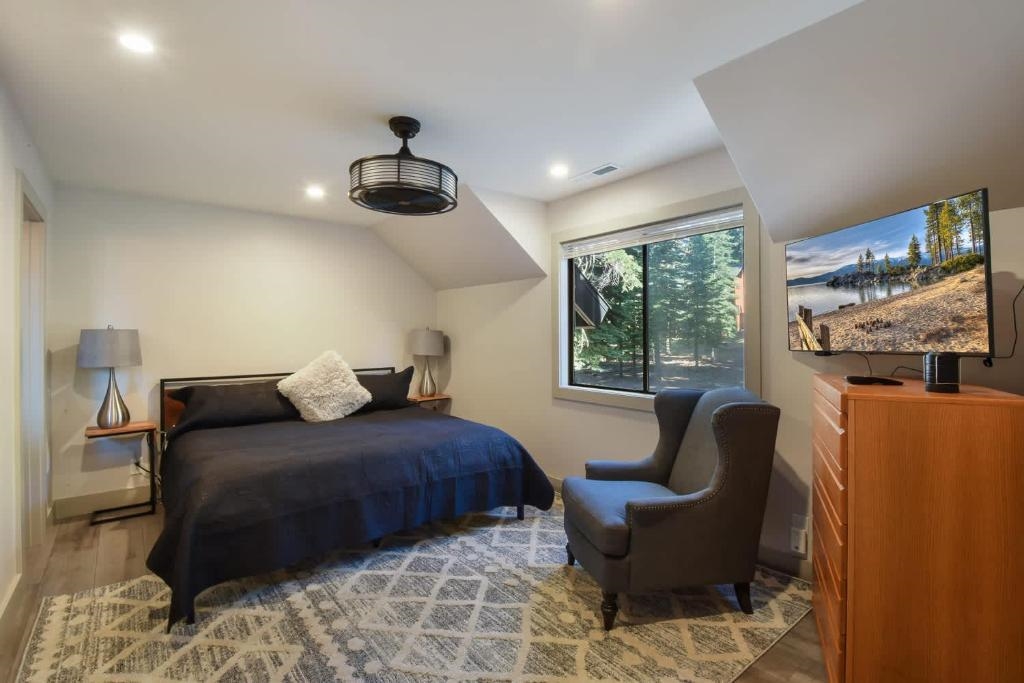 1163 Statford Way Tahoe Vista, CA 96148 - Photo 14 of 22 a bedroom with furniture and a large window