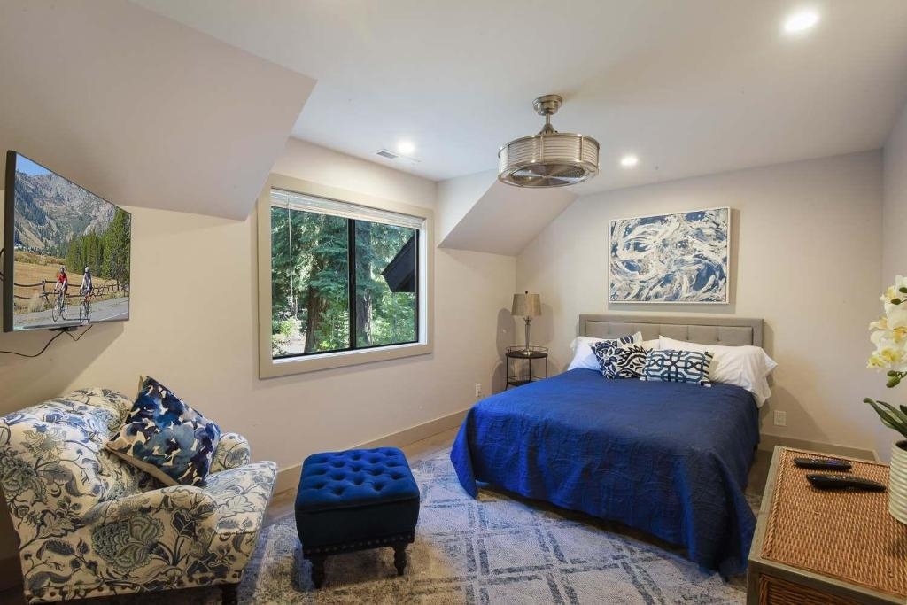 1163 Statford Way Tahoe Vista, CA 96148 - Photo 16 of 22 a bedroom with a bed and a window