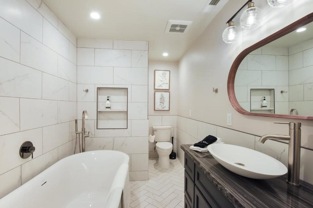 1163 Statford Way Tahoe Vista, CA 96148 - Photo 17 of 22 a bathroom with a sink a toilet and shower