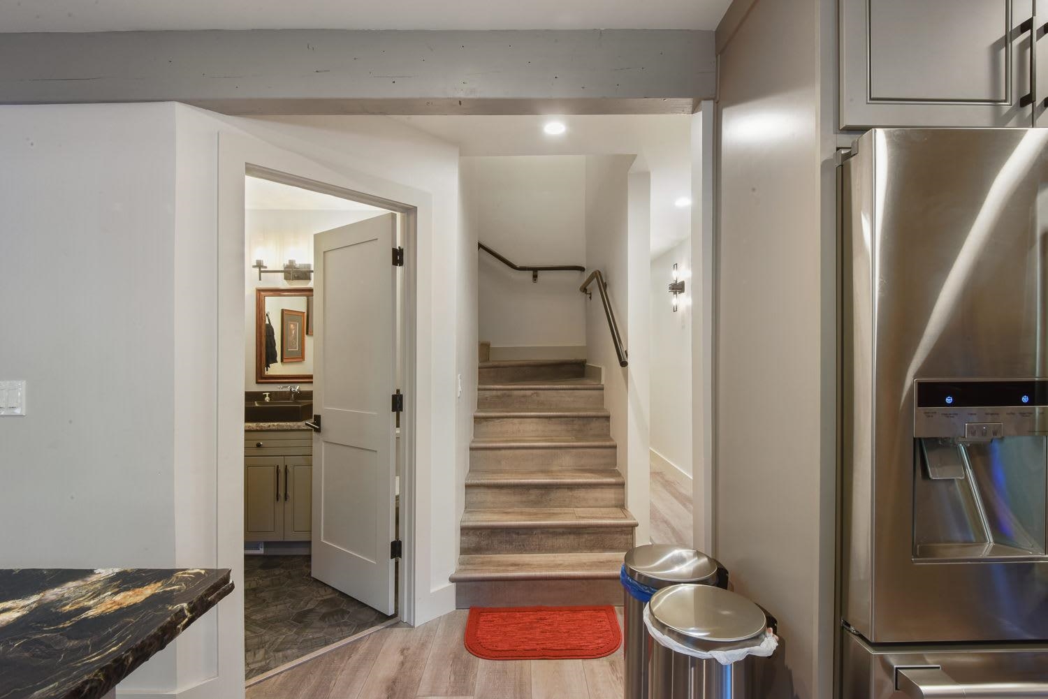 1163 Statford Way Tahoe Vista, CA 96148 - Photo 20 of 22 a bathroom with a walk in closet and wooden floor