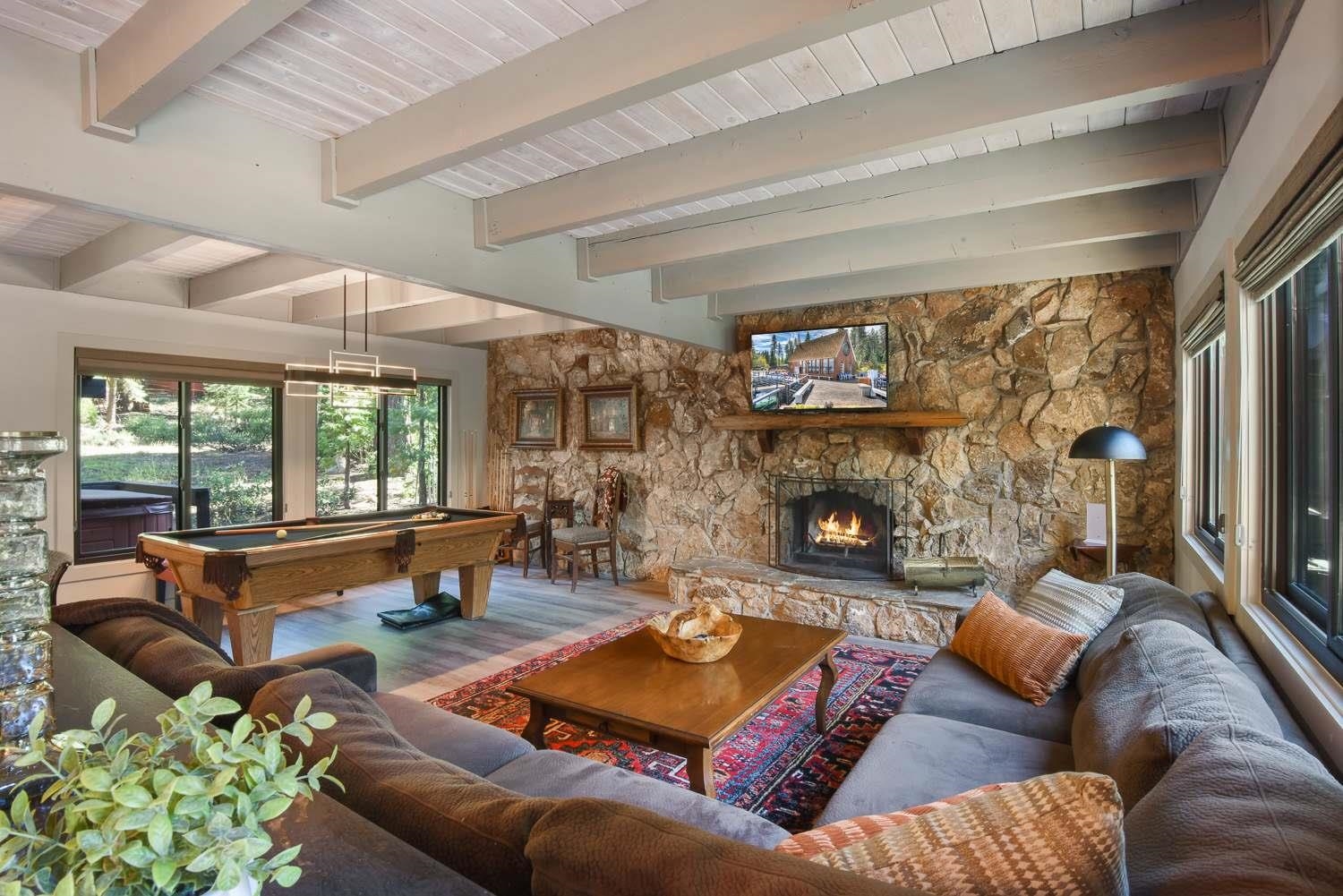 1163 Statford Way Tahoe Vista, CA 96148 - Photo 2 of 22 a living room with furniture and a fireplace