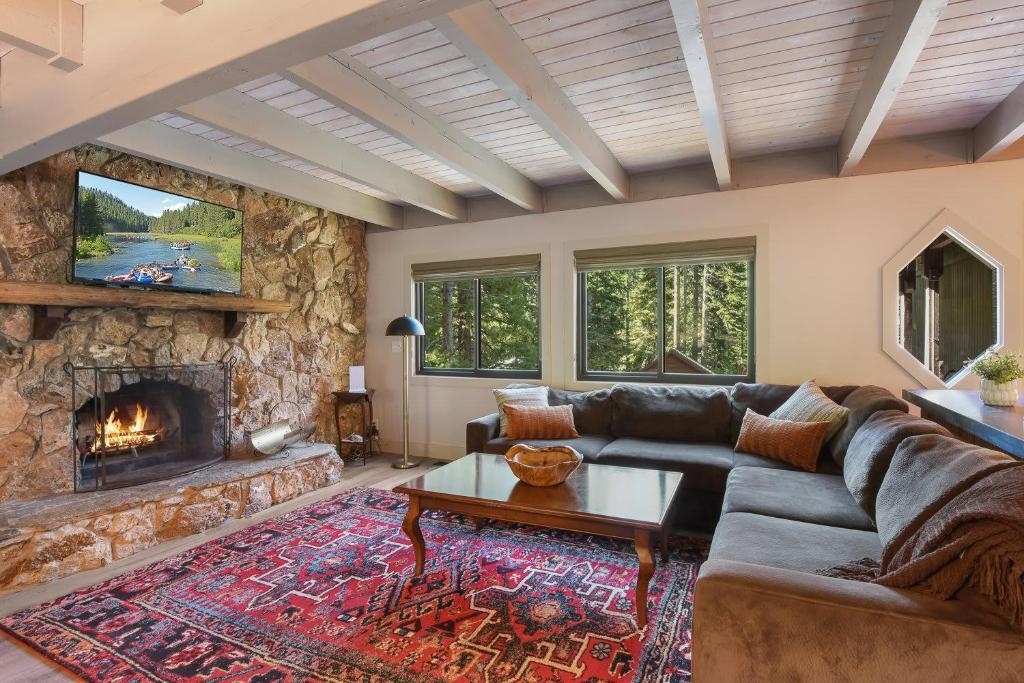 1163 Statford Way Tahoe Vista, CA 96148 - Photo 3 of 22 a living room with furniture and a fireplace