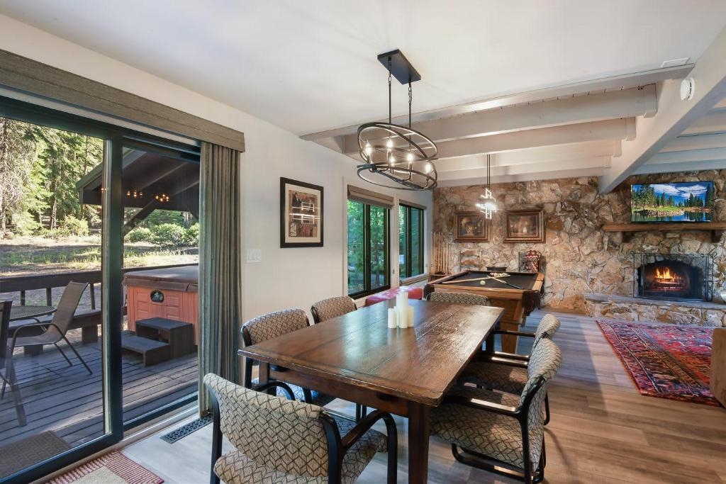 1163 Statford Way Tahoe Vista, CA 96148 - Photo 8 of 22 a view of a dining room with furniture window and wooden floor
