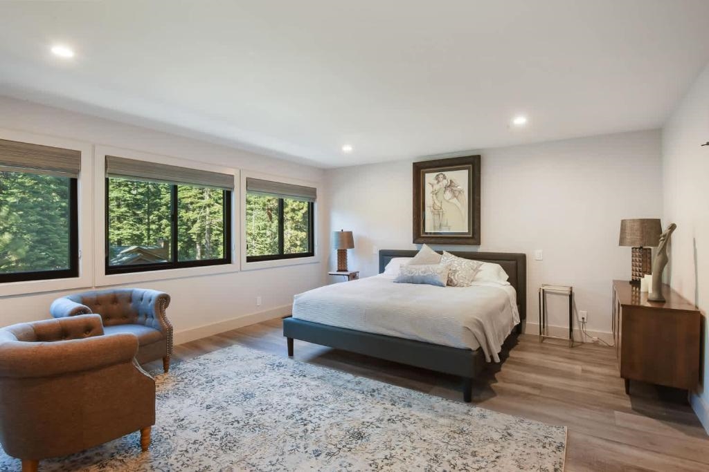 1163 Statford Way Tahoe Vista, CA 96148 - Photo 10 of 22 a bedroom with a large bed and a large window