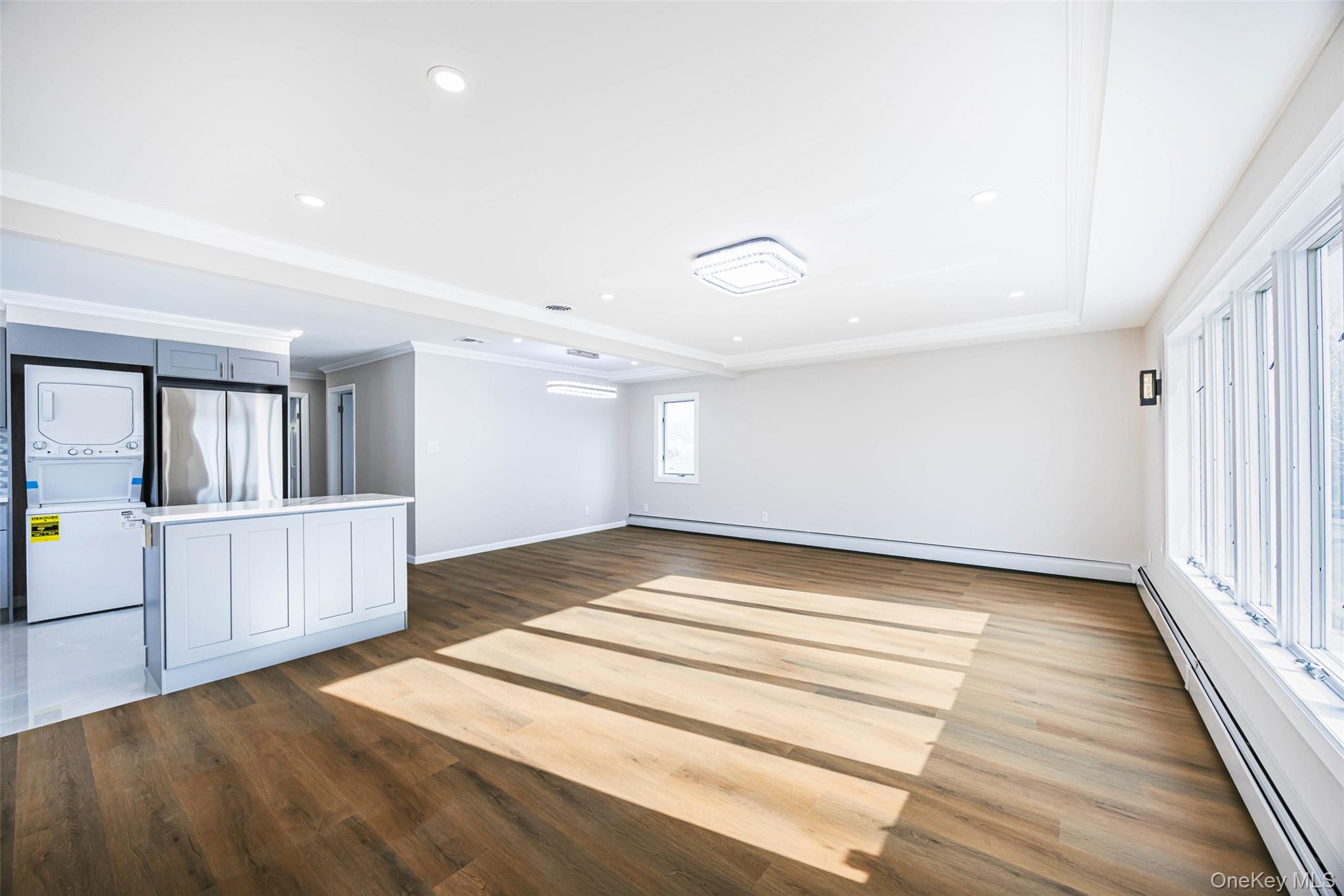 157-19 16th Road Queens, NY 11357 - Photo 23 of 33 a view of a hallway with wooden floor and staircase