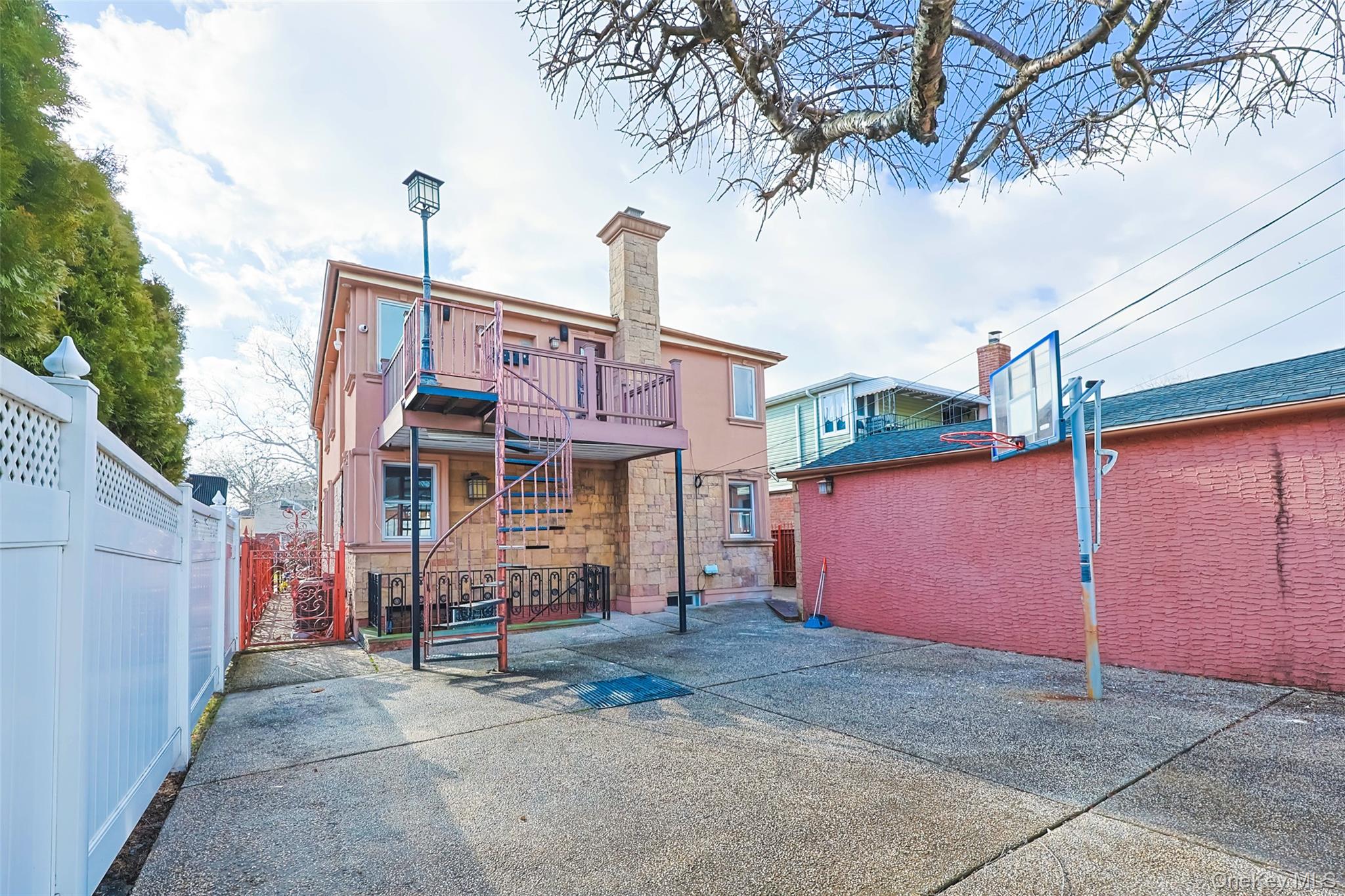 157-19 16th Road Queens, NY 11357 - Photo 7 of 33 a front view of a house with basket ball court