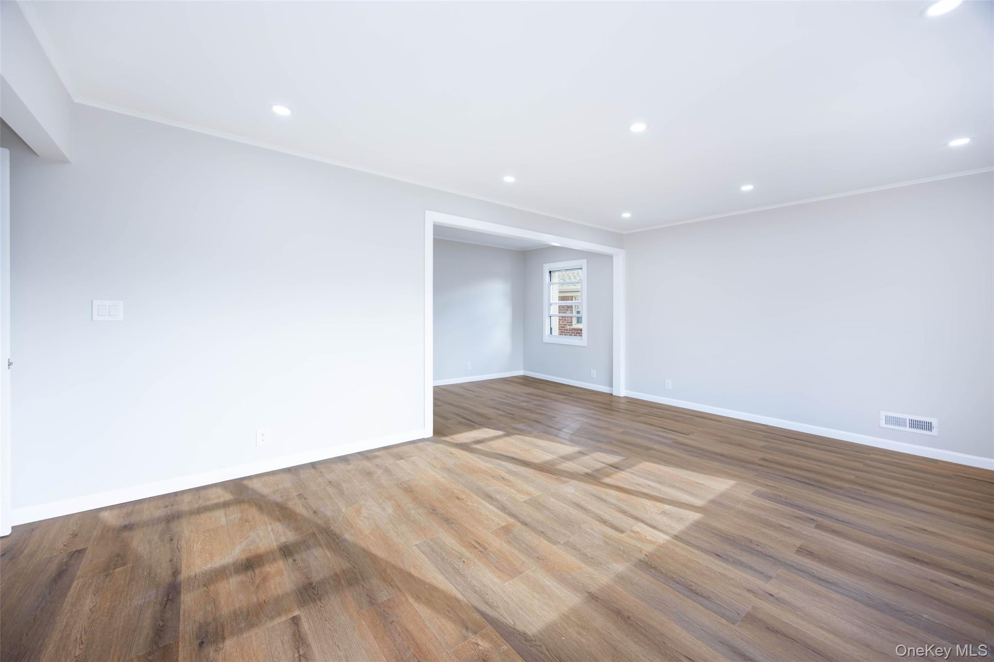 157-19 16th Road Queens, NY 11357 - Photo 8 of 33 a view of empty room with wooden floor