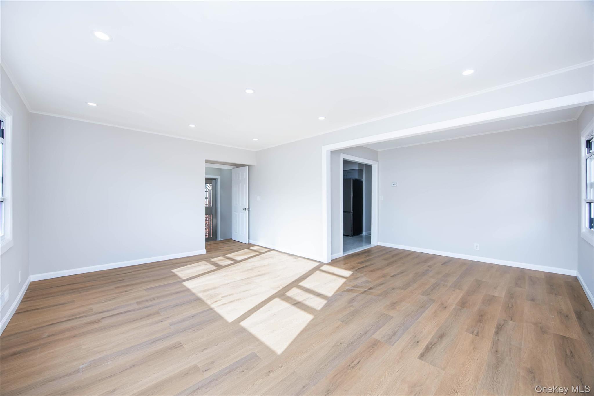 157-19 16th Road Queens, NY 11357 - Photo 10 of 33 a view of an empty room and wooden floor
