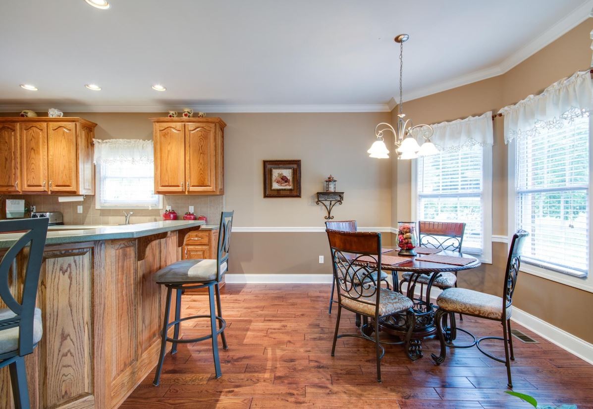 92 Freeman Court Winchester, TN 37398 - Photo 11 of 19 a view of a dining room with furniture and a chandelier