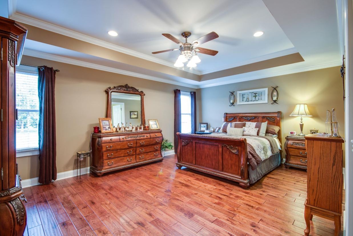 92 Freeman Court Winchester, TN 37398 - Photo 13 of 19 a bedroom with a bed and a chandelier