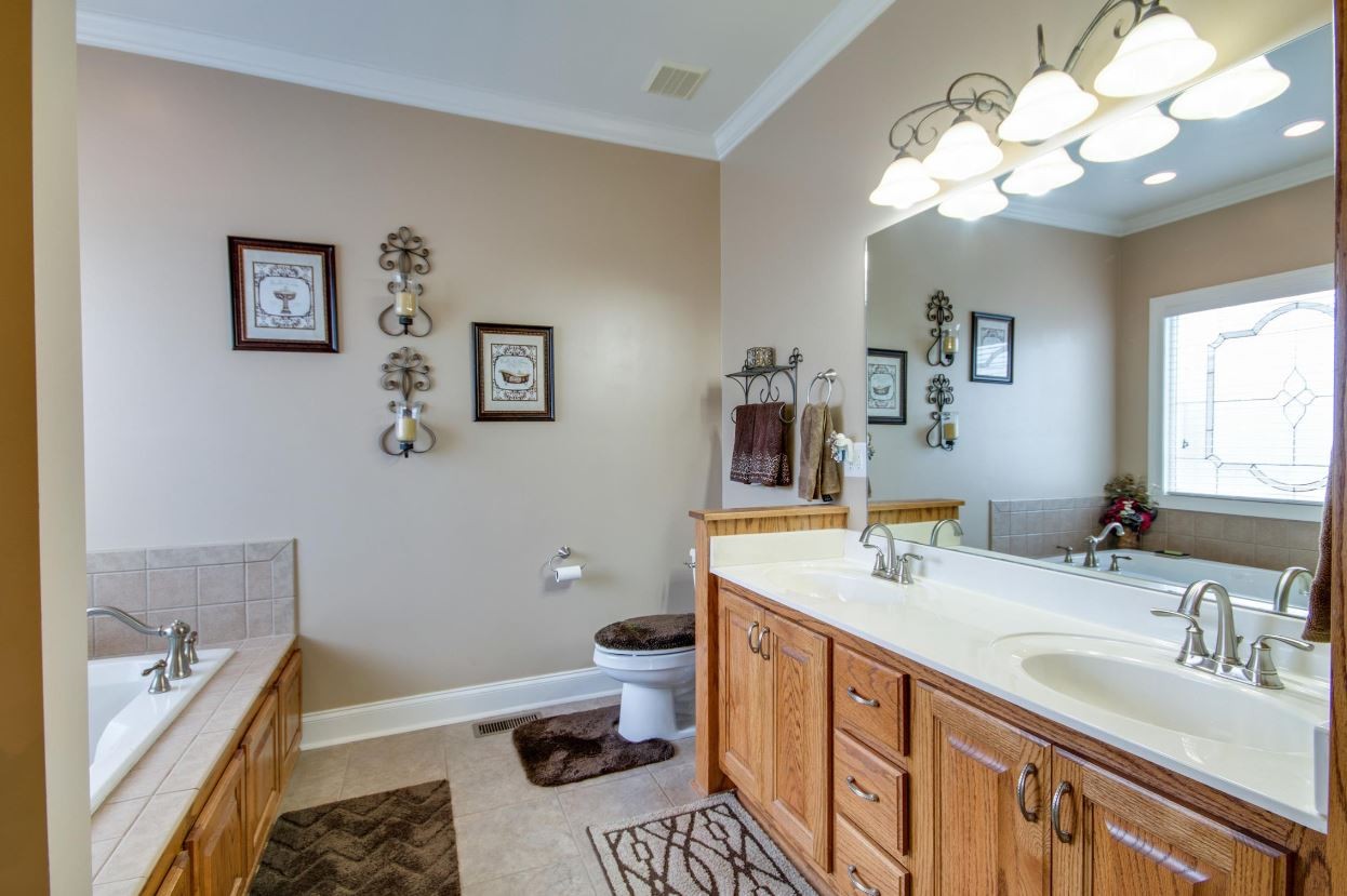92 Freeman Court Winchester, TN 37398 - Photo 15 of 19 a bathroom with a sink a vanity and a large mirror