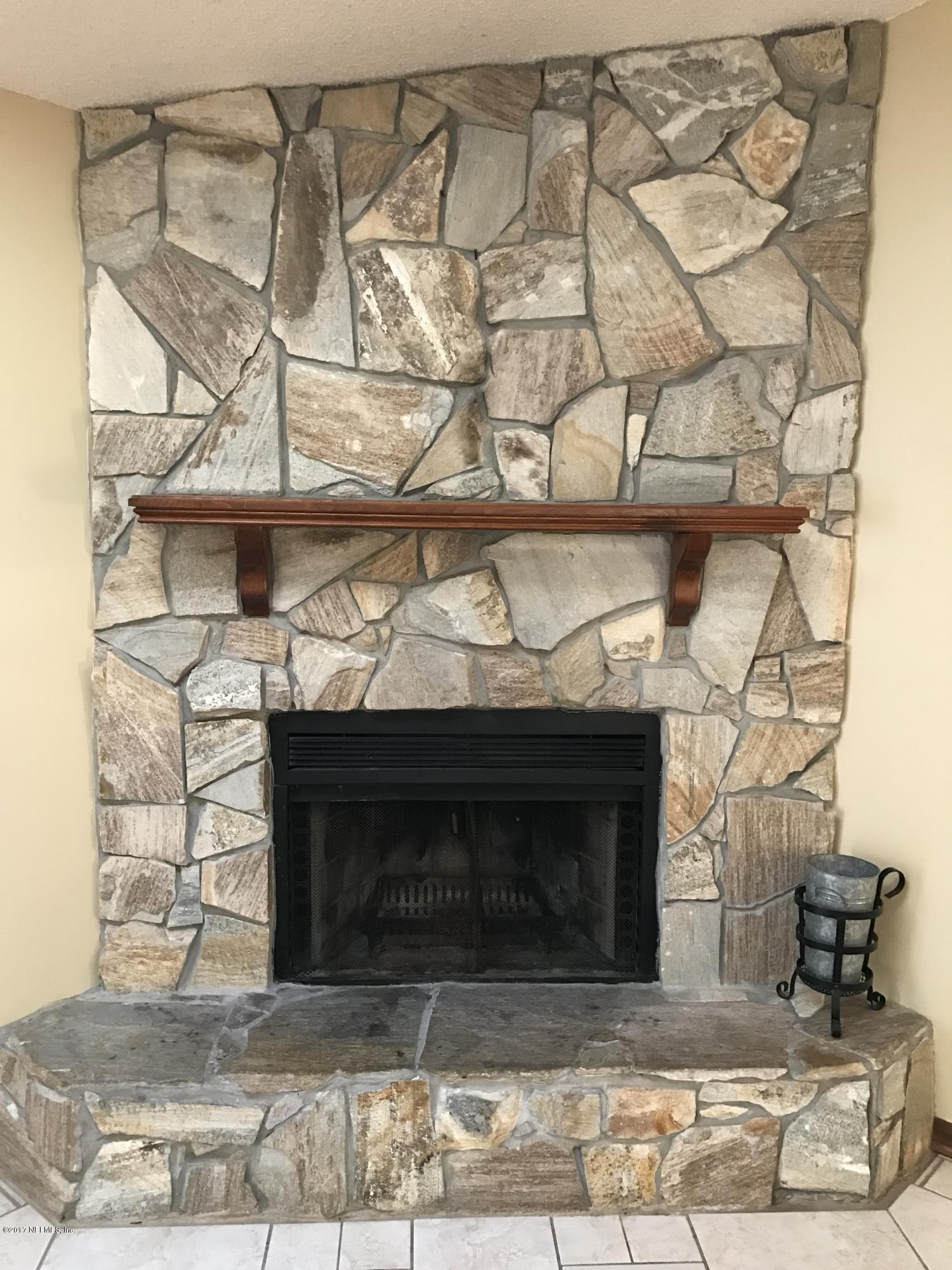 8236 Crosswind Road Jacksonville, FL 32244 - Photo 17 of 34 STONE FIREPLACE