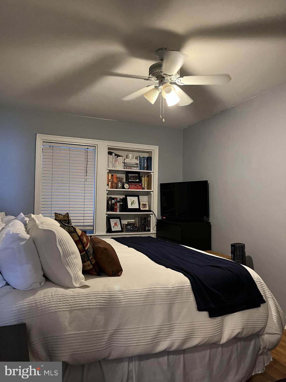 1830 Independence Avenue Southeast, Unit 4 Washington, DC 20003 - Photo 15 of 23 a bedroom with a bed and a flat screen tv