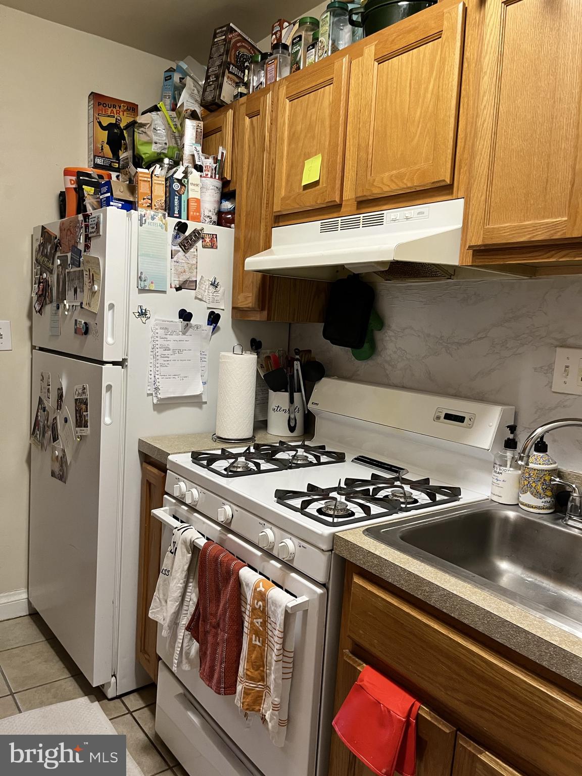 1830 Independence Avenue Southeast, Unit 4 Washington, DC 20003 - Photo 18 of 23 a kitchen with stainless steel appliances granite countertop a stove and a refrigerator