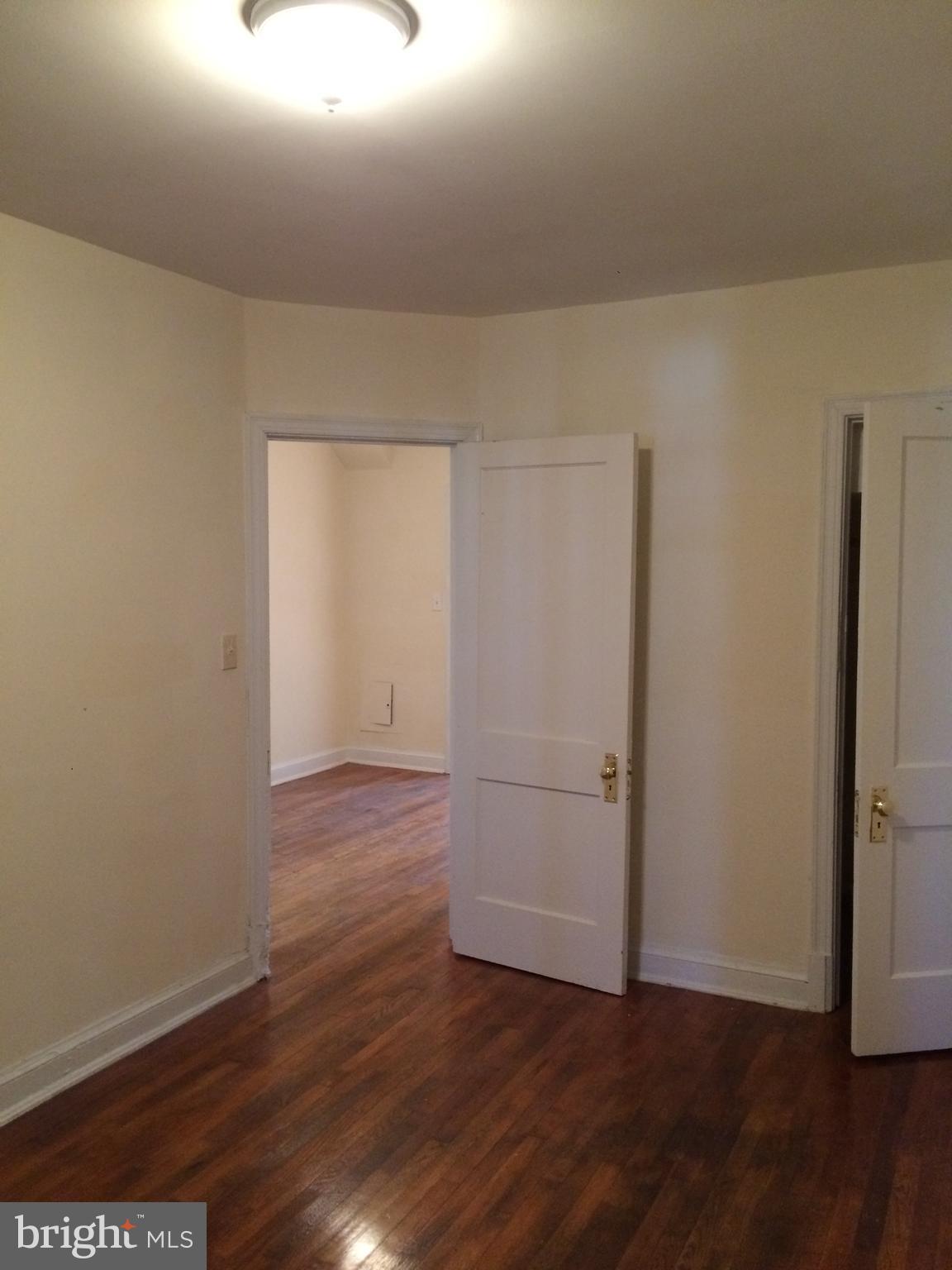 1830 Independence Avenue Southeast, Unit 4 Washington, DC 20003 - Photo 3 of 23 a view of an empty room with wooden floor