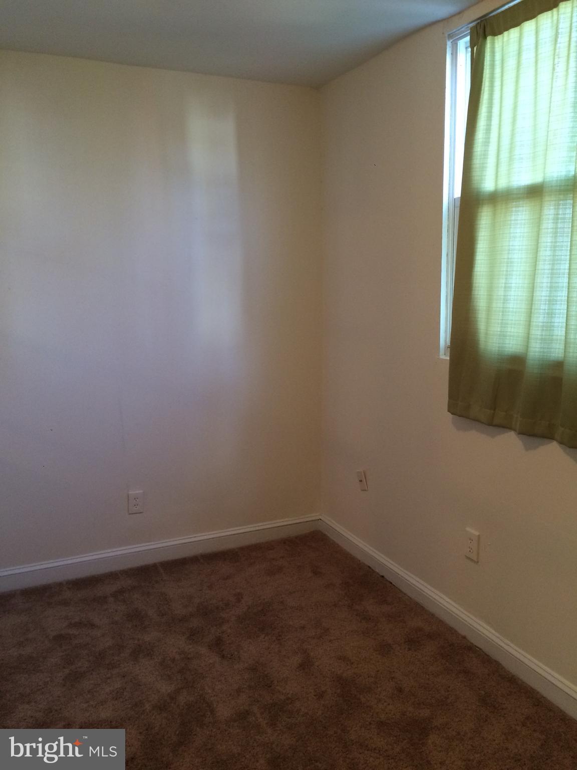 1830 Independence Avenue Southeast, Unit 4 Washington, DC 20003 - Photo 6 of 23 an empty room with a window