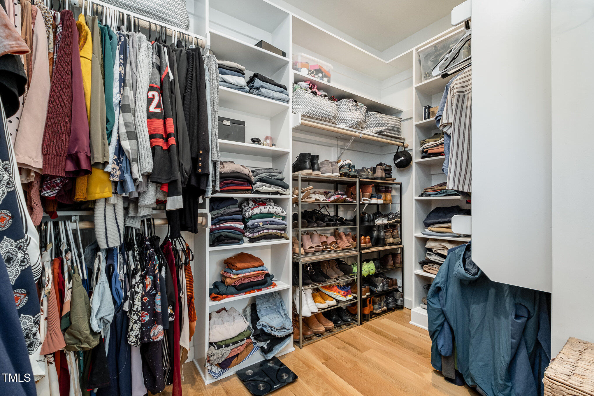 517 Bart Street Raleigh, NC 27610 - Photo 16 of 43 a view of walk in closet with clothes and shoes