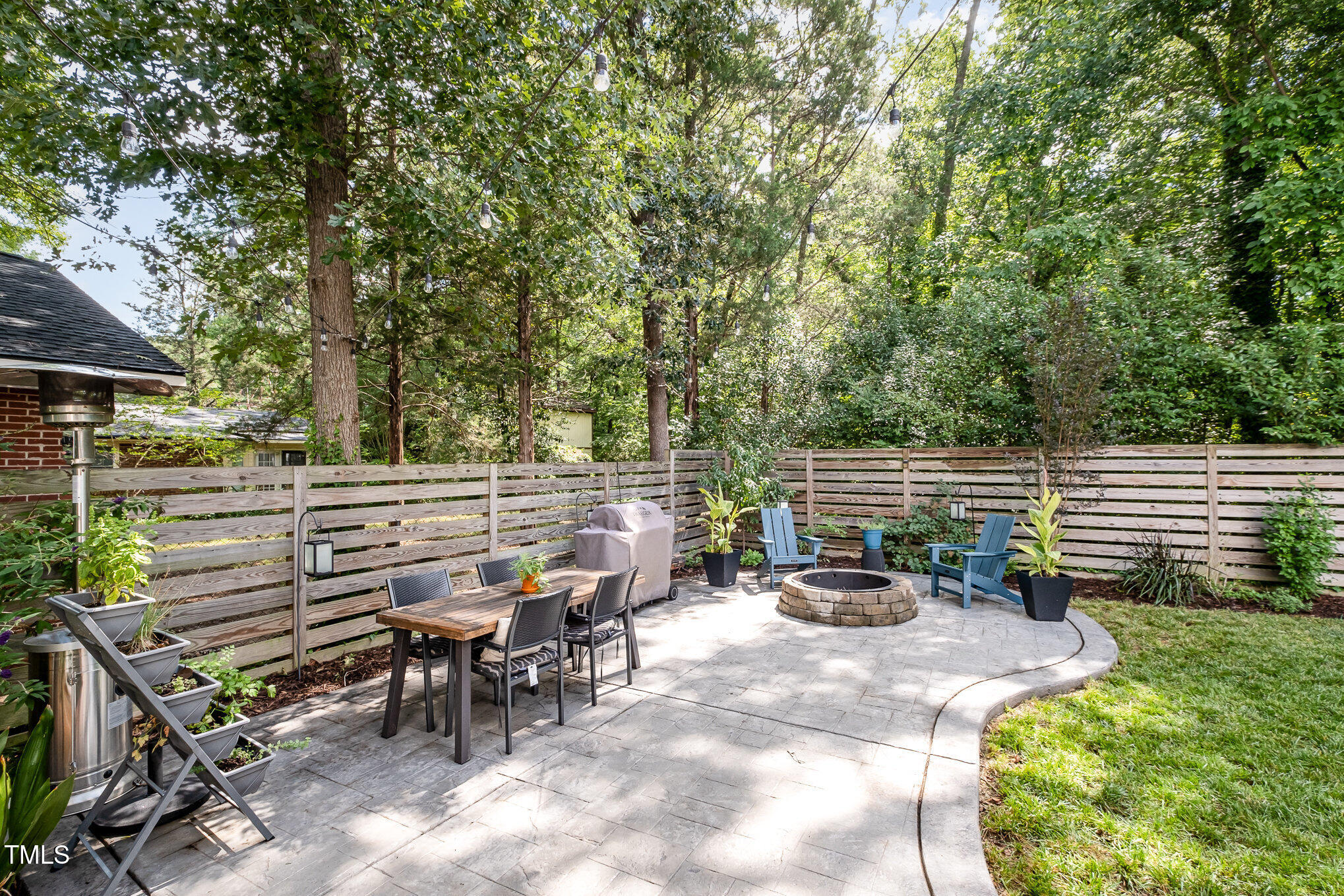 517 Bart Street Raleigh, NC 27610 - Photo 27 of 43 a view of a chair and tables in the backyard