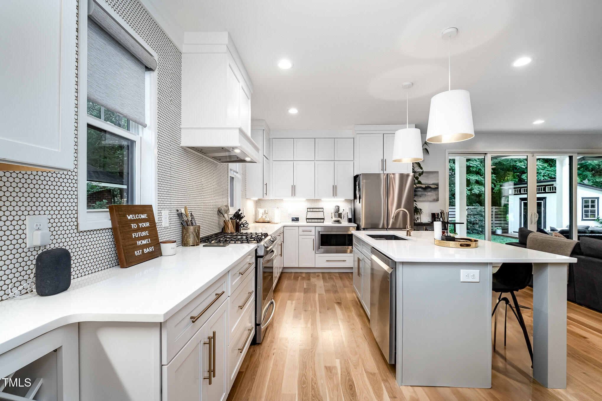 517 Bart Street Raleigh, NC 27610 - Photo 6 of 43 a kitchen with stainless steel appliances granite countertop a sink stove and refrigerator
