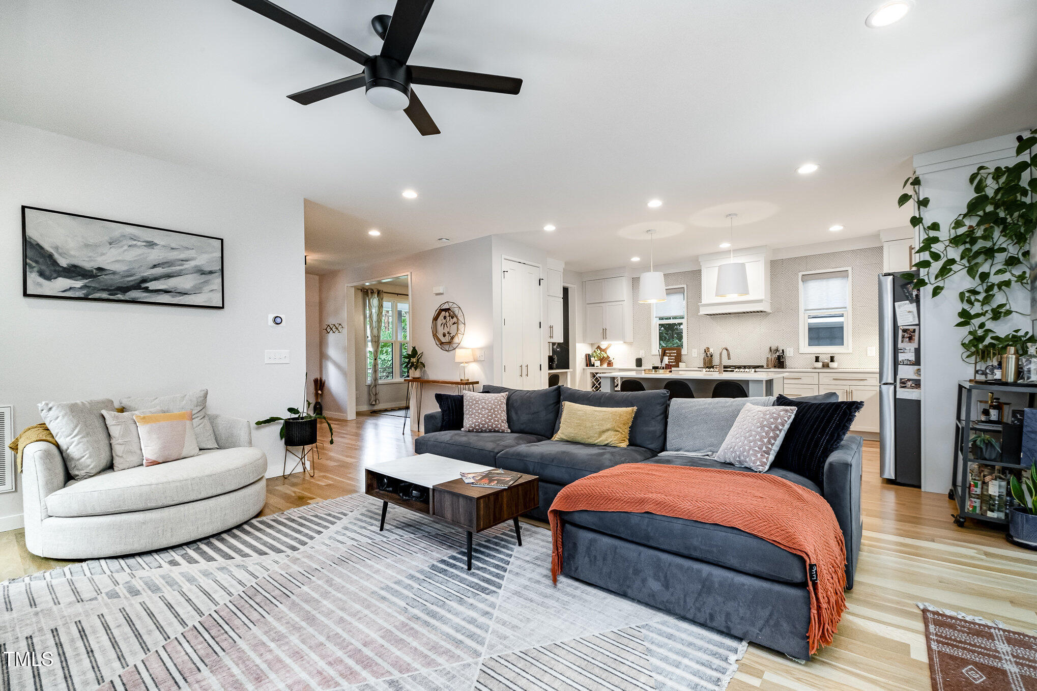 517 Bart Street Raleigh, NC 27610 - Photo 10 of 43 a living room with furniture and a view of kitchen