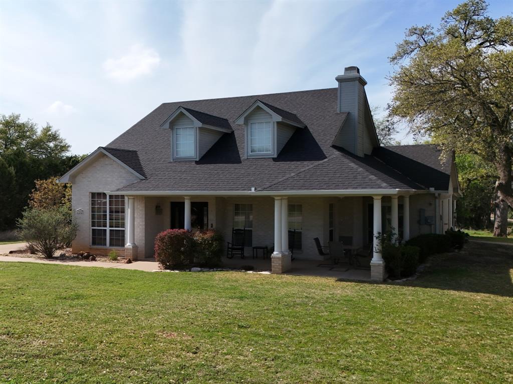 32018 Dove Trail Whitney, TX 76692 - Photo 1 of 36 a house view with a garden space